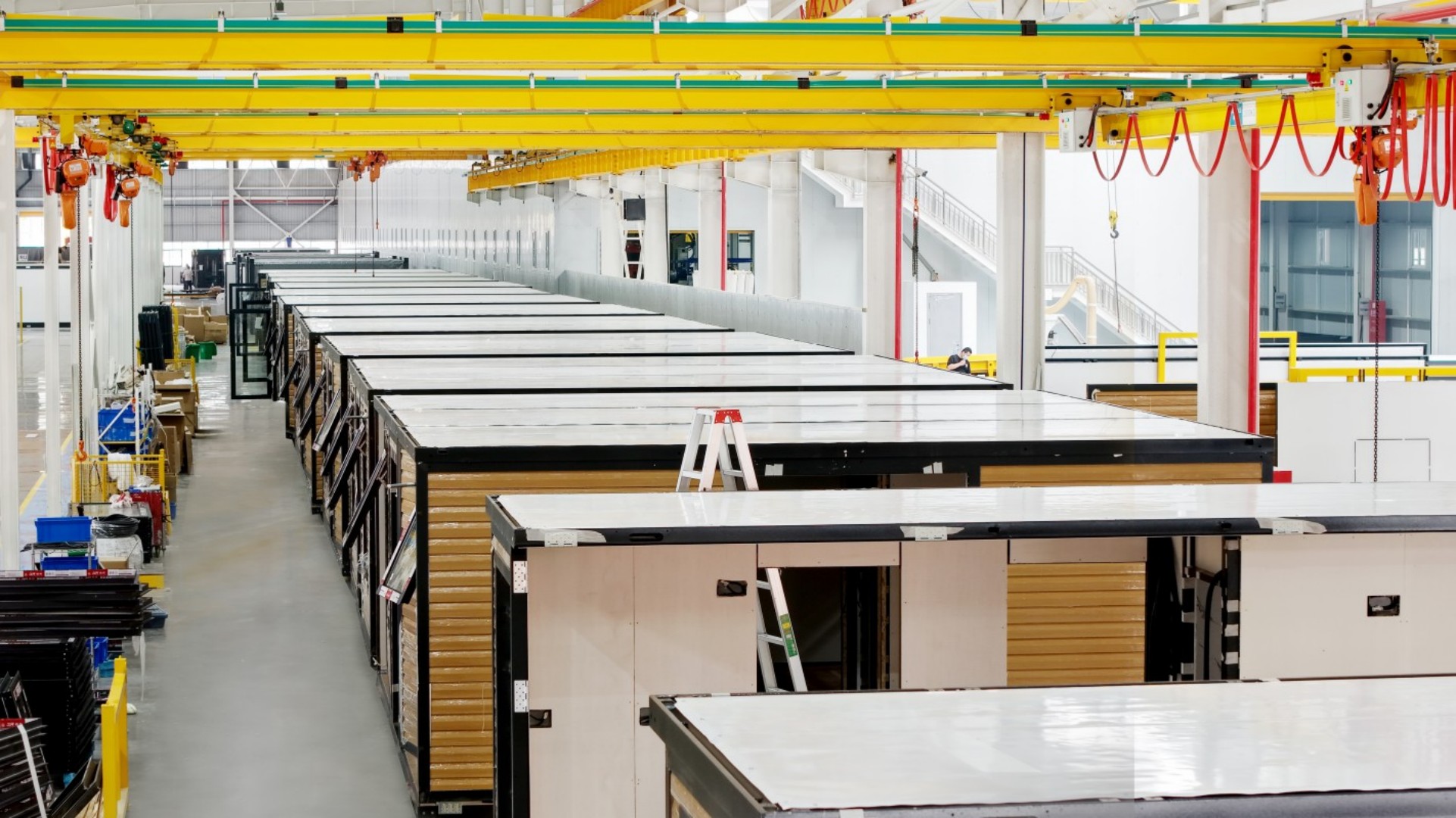 Automated welding robots in PTHouse smart factory
